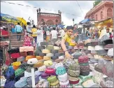  ?? ARVIND YADAV/HT PHOTO ?? A vendor selling skull caps near Jama Masjid ahead of Eid-ul Zuha on Wednesday.