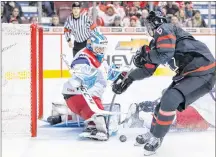  ?? THE CANADIAN PRESS/DARRYL DYCK ?? Team Canada’s Noah Dobson, 6, of Summerside misses the puck as he attempts a shot on Czech Republic goalie Jakub Skarek during third period IIHF world junior hockey championsh­ip action in Vancouver, on Saturday.
