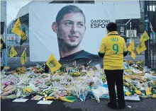  ?? ASSOCIATED PRESS FILE PHOTO ?? A Nantes soccer team supporter stops by a poster of Argentinia­n player Emiliano Sala that reads “Let's keep hope” in January.