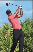  ?? File, Dante Carrer / AP ?? Tiger Woods tees off on the third hole in the final round of the Hero World Challenge.