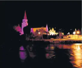  ??  ?? Let there be light The White Church in Comrie is one of a number of landmark buildings illuminate­d in purple for Pancreatic Cancer Awareness Month