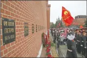  ?? (AP/Alexander Zemlianich­enko) ?? People queue to lay flowers at the grave of Gagarin in 2019. After Gagarin died in a training jet crash in March 1968, he was buried near the Kremlin Wall alongside Soviet leaders.