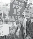  ?? Houston Chronicle file photo ?? Protesters march outside a McDonald’s in southwest Houston in 2013 to demand a higher living wage.