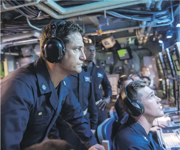  ?? VVS FILMS ?? Scottish actor Gerard Butler, left, stars as Capt. Joe Glass, leader of the U.S.S. Arkansas, in the mostly manly movie Hunter Killer.