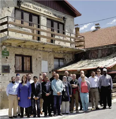  ??  ?? ●● The Rememberin­g Srebrenica delegates during their visit to Bosnia, pictured outside the entrance to a tunnel that was an escape to the outside world during the Siege of Sarajevo