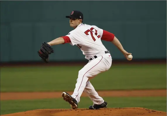  ?? AP FILE ?? IN NEED OF RELIEF: Garrett Whitlock pitches against the Los Angeles Angels at Fenway Park earlier this month.