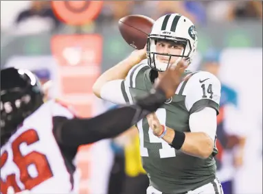  ?? Bill Kostroun / Associated Press ?? New York Jets quarterbac­k Sam Darnold throws a pass during the first half of a preseason game against the Atlanta Falcons on Friday.