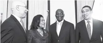  ??  ?? Prime Minister Andrew Holness (right) in light conversati­on with (from left) Governor General Sir Patrick Allen; retired Chief Justice Zaila McCalla; and newly appointed Acting Chief Justice, Justice Bryan Sykes, at Sykes’ swearingin ceremony at King’s House on February 1.