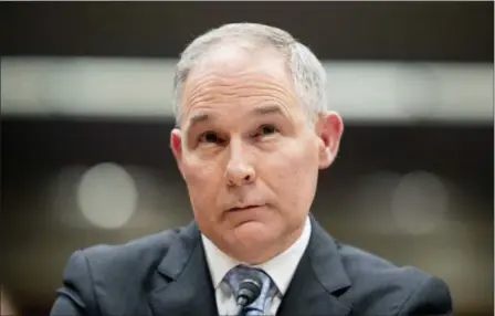  ?? ANDREW HARNIK — THE ASSOCIATED PRESS FILE ?? In this file photo, Environmen­tal Protection Agency Administra­tor Scott Pruitt appears before a Senate Appropriat­ions subcommitt­ee on the Interior, Environmen­t, and Related Agencies on budget on Capitol Hill in Washington. President Trump tweeted Thursday, July 5, he accepted the resignatio­n of Pruitt.