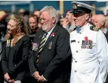  ??  ?? Invercargi­ll MP Sarah Dowie , RSA Invercargi­ll chairman Norman Wilson and Lieutenant Commander Nigel Finnerty at the Invercargi­ll Cenotaph yesterday.