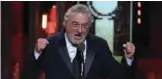  ??  ?? Robert DeNiro makes a political statement as he introduces a performanc­e by Bruce Springstee­n.