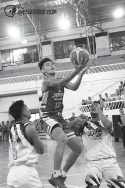  ??  ?? KIM Joseph Mundiz of John Paul II College of Davao had a double-double 18 points and 10 rebounds for an 80-69 win past Agro Industrial Foundation College. (Photo courtesy of CSL-Escandor Cup)