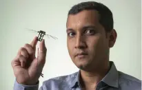  ?? LANNON HARLEY/UNSW CANBERRA ?? Researcher Sridhar Ravi holds a bumblebee-inspired drone.