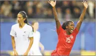 ?? Francisco Seco / Associated Press ?? Canada’s Nichelle Prince, right, celebrates after scoring her side’s second goal against New Zealand on Saturday.