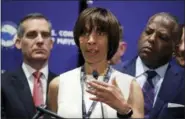  ?? CHARLES KRUPA — THE ASSOCIATED PRESS ?? Baltimore Mayor Catherine Pugh addresses a gathering during the annual meeting of the U.S. Conference of Mayors in Boston on Friday. With Pugh are Los Angeles Mayor Eric Garcetti, left, and Columbia, SC Mayor Steve Benjamin.