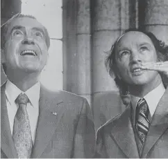  ?? CANADIAN PRESS FILES ?? U. S. President Richard Nixon looks up at some odd stone carvings pointed out by Prime Minister Pierre Trudeau in the Rotunda on Parliament Hill in this 1972 photo.