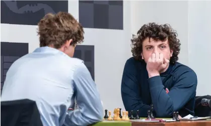  ?? Photograph: Crystal Fuller/Saint Louis Chess Club ?? Hans Niemann, right, plays against Magnus Carlsen at last month’s Sinquefiel­d Cup in St Louis.