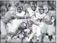  ?? HARRY HOW — GETTY IMAGES ?? Cal’s Patrick Laird, right, runs past Adarius Pickett and Keisean Lucier-South of UCLA at the Rose Bowl.