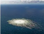  ?? ARMED FORCES OF DENMARK VIA THE NEW YORK TIMES ?? A photo released by the Danish military in September 2022 shows gas bubbles from the Nord Stream 2 leak reaching the surface of the Baltic Sea, near the Danish island of Bornholm.