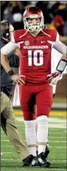  ?? NWA Media/MICHAEL WOODS ?? Arkansas quarterbac­k Brandon Allen waits on a fourth-quarter replay that resulted in Arkansas turning over the ball on a fumble, which sealed Missouri’s victory.