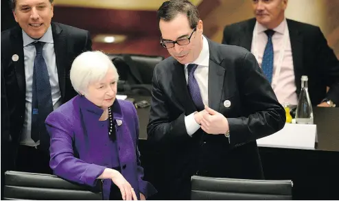  ?? THOMAS KIENZLE / AFP / GETTY IMAGES ?? U. S. Treasury Secretary Steven Mnuchin speaks with Federal Reserve chair Janet Yellen in Germany on Friday.