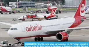  ?? — AFP ?? DUESSELDOR­F: This file photo taken on September 12, 2017 shows aircraft of German airline Air Berlin parked at the airport in Duesseldor­f, western Germany, after the troubled airline had to cancel flights due to “operationa­l reasons”.