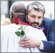  ??  ?? Andrew, (right), father of Saffie-Rose Roussos, receives comfort from a member of the clergy prior to her funeral service at Manchester Cathedral in Manchester, northwest England on
July 26. (AFP)