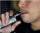  ?? AFP file ?? health risks: a man smokes an e-cigarette at the Vaping Buddha in south san Francisco. Us doctors are investigat­ing the cases of many teens who were hospitalis­ed with lung injuries after vaping. —