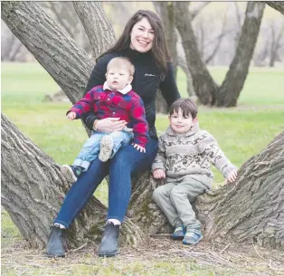  ?? BRANDON HARDER ?? Whitney Blaisdell shares a moment with her children August and Jonah Kissick. She is a founder of Project Play YQR, a partnershi­p with the Regina Early Learning Centre.