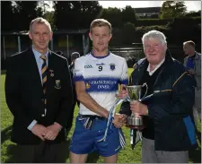  ??  ?? St Pat’s captain Terry Healy accepts the Junior ‘C’ cup from County Chairman Martin Fitzgerald and Mick Hagan.