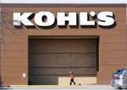  ?? AP PHOTO/CHARLIE NEIBERGALL ?? A woman arrives at a Kohl’s store in Feb. 2021 in West Des Moines, Iowa.