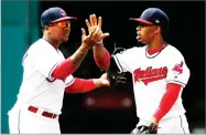  ?? AP PHOTO BY RON SCHWANE ?? Cleveland Indians’ Jose Ramirez, left, and Francisco Lindor, celebrate a 2-1 win over the Los Angeles Angels in a baseball game, Thursday, in Cleveland.