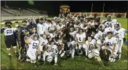  ?? BEN HASTY — READING EAGLE ?? Wyomissing gathers on the field after winning its second straight District 3 Class 3A football championsh­ip.