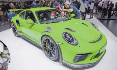  ?? Pictures / AP ?? Porsche 911 GT3 RS (above); Bentley Motors Bentayga Hybrid (far left); Rupert Stadler, Audi CEO, presents the Audi A6 (left).