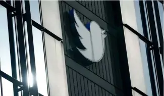  ?? ?? FILE - A Twitter logo hangs outside the company's offices in San Francisco, Dec. 19, 2022.