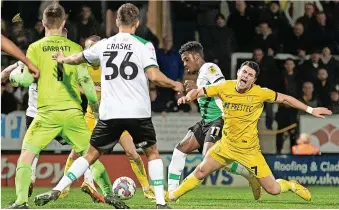  ?? ?? Deep in stoppage time – and with goalkeeper Ben Garratt having joined the attack – Burton were convinced they should have had a penalty when Niall Ennis caught Joe Powell as he was about to shoot (left) but the referee disagreed.