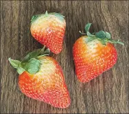  ?? Submitted photo ?? The strawberry symbolizes love and fertility due to its shape, color and wealth of seeds on the fruit surface, says MU Extension horticultu­rist Michele Warmund. According to folklore, if two people share a strawberry, they will fall in love.