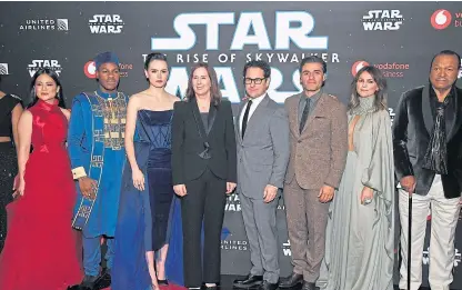  ??  ?? From left: Cast members Kelly Marie Tran, John Boyega, Daisy Ridley, Kathleen Kennedy, director JJ Abrams, Oscar Isaac, Keri Russell and Billy Dee Williams at the London premiere. Shuttersto­ck.