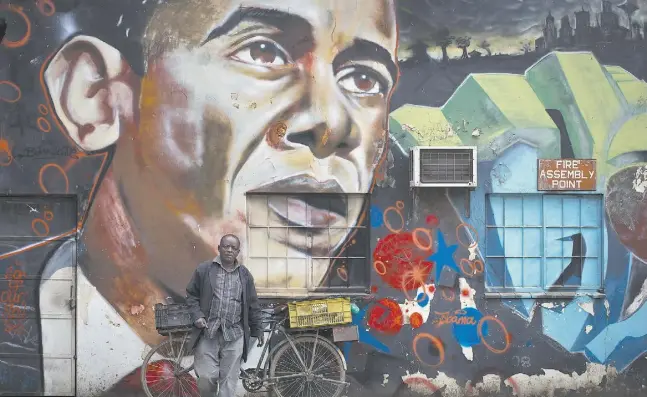  ?? Ben Curt
is / The Associated
Pres ?? A a mural of President Barack Obama, created by the Kenyan graffiti artist Bankslave, in Nairobi. The U.S. president arrives in Kenya on Friday.