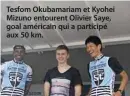  ??  ?? Tesfom Okubamaria­m et Kyohei Mizuno entourent Olivier Saye, goal américain qui a participé aux 50 km.