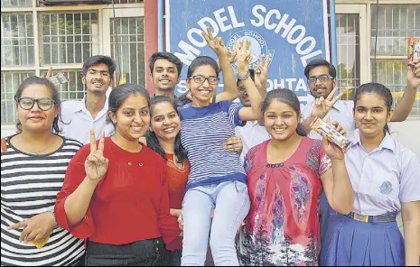  ?? MANOJ DHAKA/HT ?? Girls of Class 12 celebratin­g their success at a school in Rohtak, after the declaratio­n of CBSE results on Saturday.