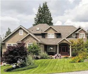  ??  ?? Top: The interior of the home at 11155 92A Ave. in North Delta features hardwood and tile flooring with radiant heat. Above: The home is located close to schools and transit.