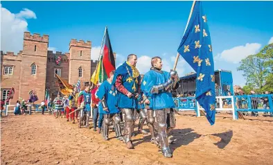  ?? Pictures: Steve MacDougall. ?? Competitor­s in medieval costume in the parade of internatio­nal teams at Scone Palace.