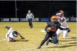  ?? Staff photo by Joshua Boucher ?? Nashville’s Trent Harris narrowly escapes the grasp of Pea Ridge’s Ethan Burton on Friday at Scrapper Stadium.