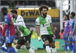  ?? KIN CHEUNG — THE ASSOCIATED PRESS ?? Liverpool's Mohamed Salah, center, celebrates after scoring his side's opening goal during a Premier League match against Crystal Palace at Selhurst Park on Saturday.