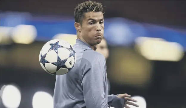  ??  ?? Real Madrid forward Cristiano Ronaldo takes part in training at the Principali­ty Stadium in Cardiff, where the roof will be closed for tonight’s Champions League final.