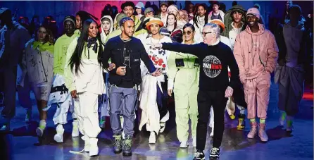  ??  ?? The new collection designed by hamilton (centre) is calm, cool and colourful. he is pictured here with hilfiger (right) himself. — aFP