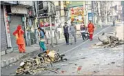  ?? MANOJ DHAKA/HT ?? Shops and motorcycle­s burnt in Rohtak on Saturday.