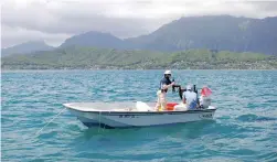  ?? PICTURE: AP ?? GOOD SCIENCE: The CORAL team prepare to deploy optical measuring instrument­s in Oahu’s Kaneohe Bay, Hawaii.