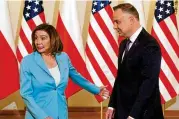  ?? JANEK SKARZYNSKI / AFP ?? House Speaker Nancy Pelosi stands next to Polish President Andrzej Duda as they meet in Warsaw Monday.